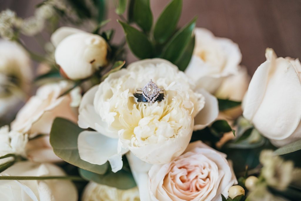 Something Blue Weddings Ring Shot on Flowers Ring Detail Shots