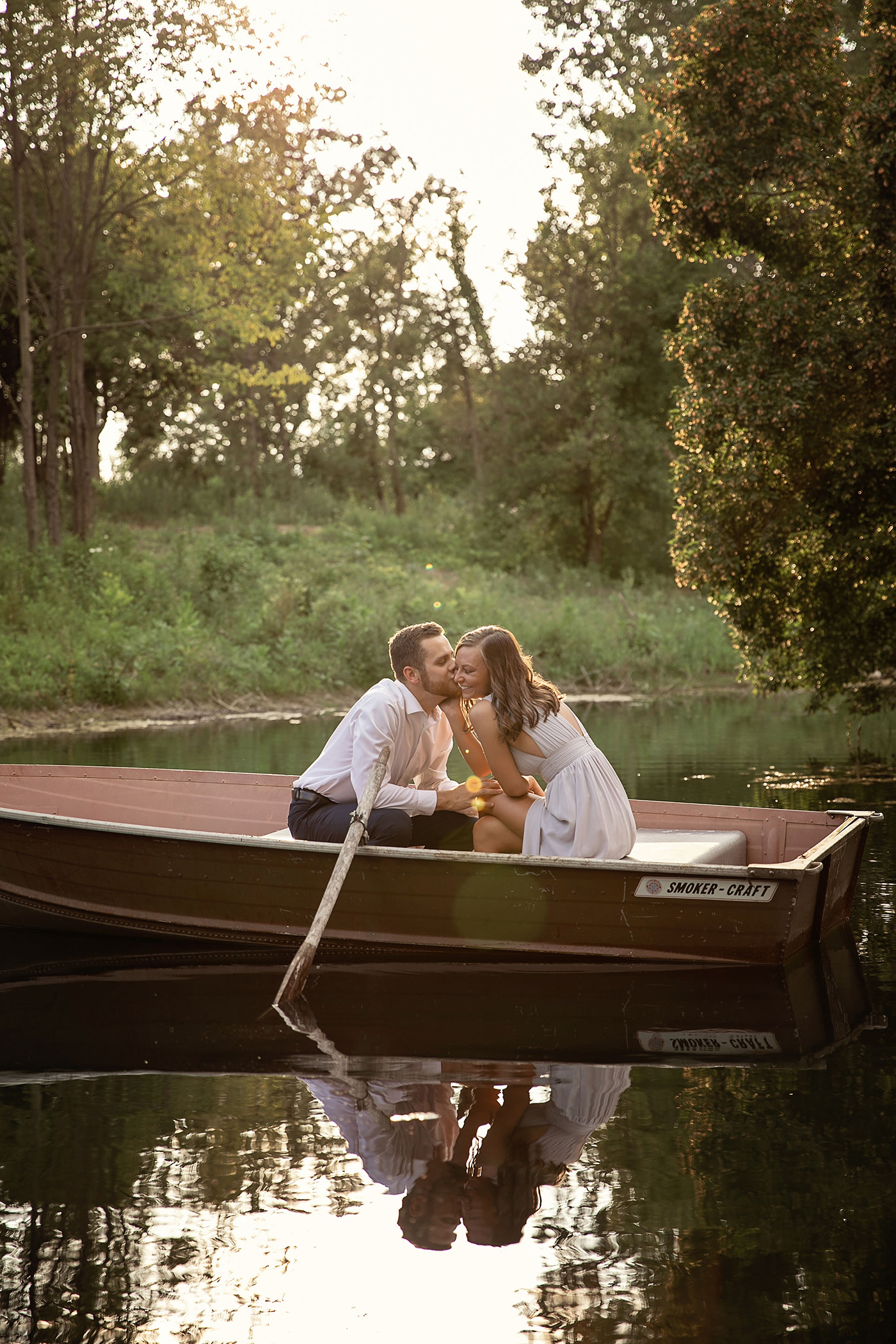 lakeside engagement photo shoot rowboat the notebook