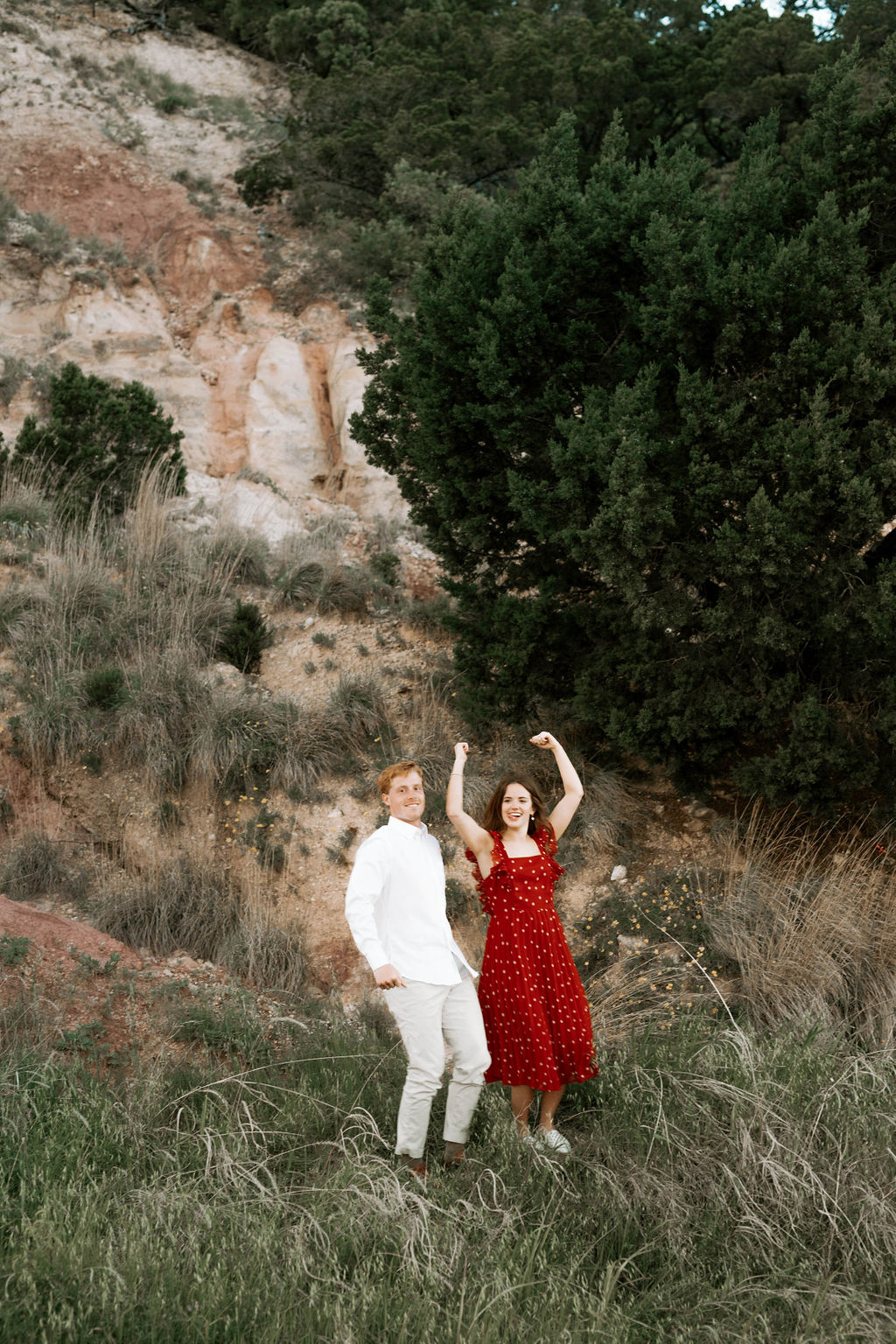 romantic sunset engagement session red dress