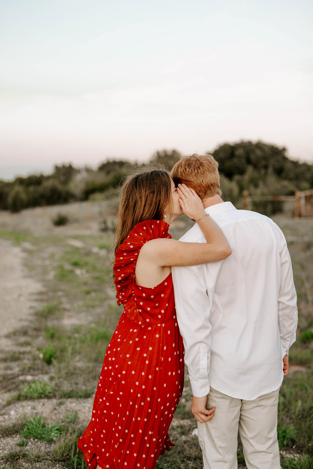 romantic sunset engagement session red dress